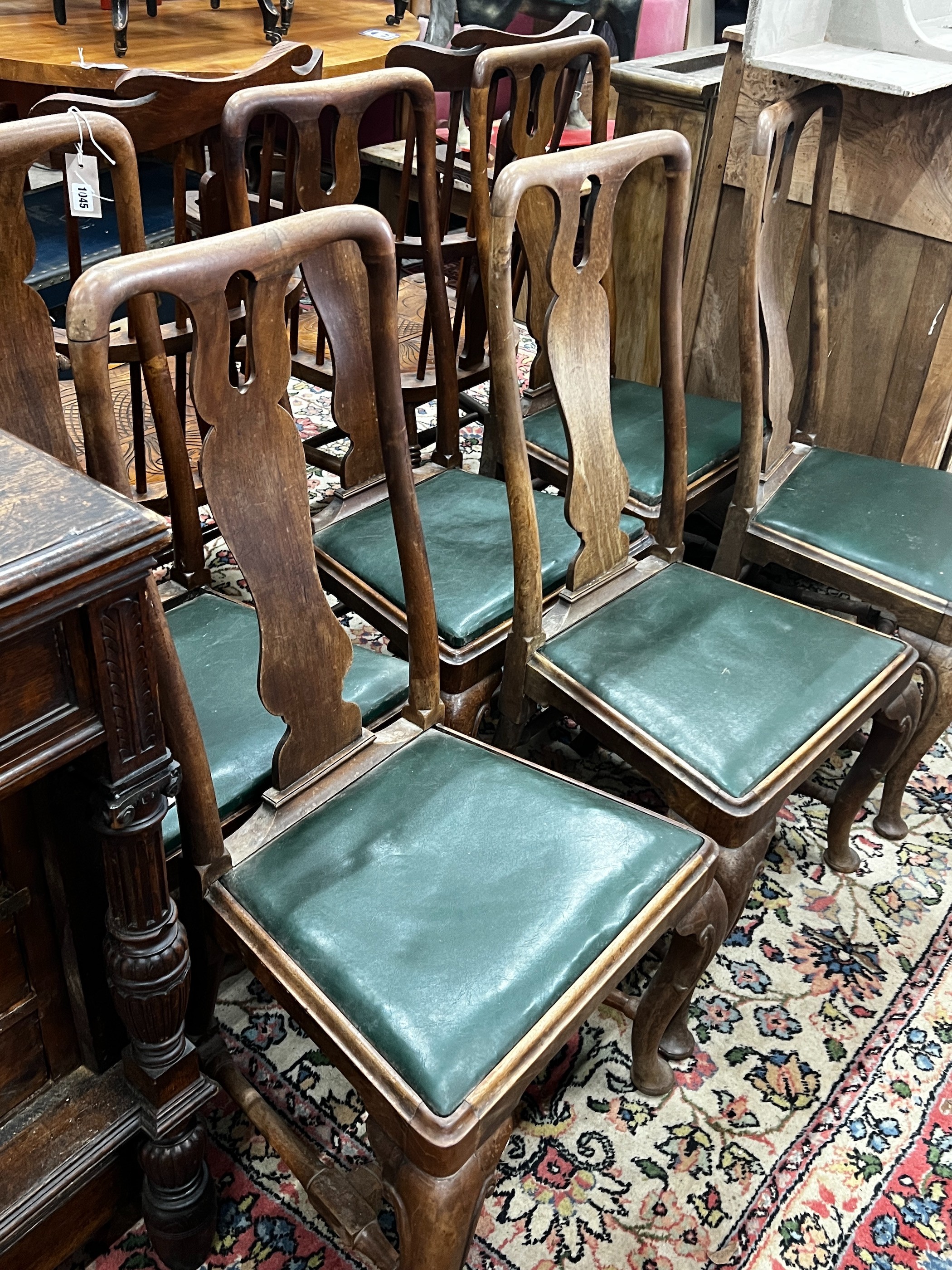 A set of six Georgian walnut dining chairs